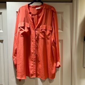 Calvin Klein button down coral blouse with two front pockets,